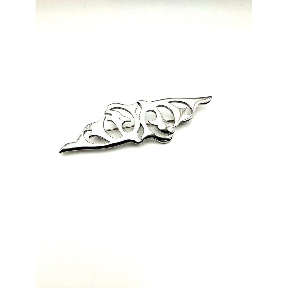 21.  Signed Ginnie Johansen brooch